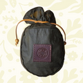 Forager Provisions LTD Journeyman Handcraft forest green waxed canvas coffee pouch with a leather tie closure.
