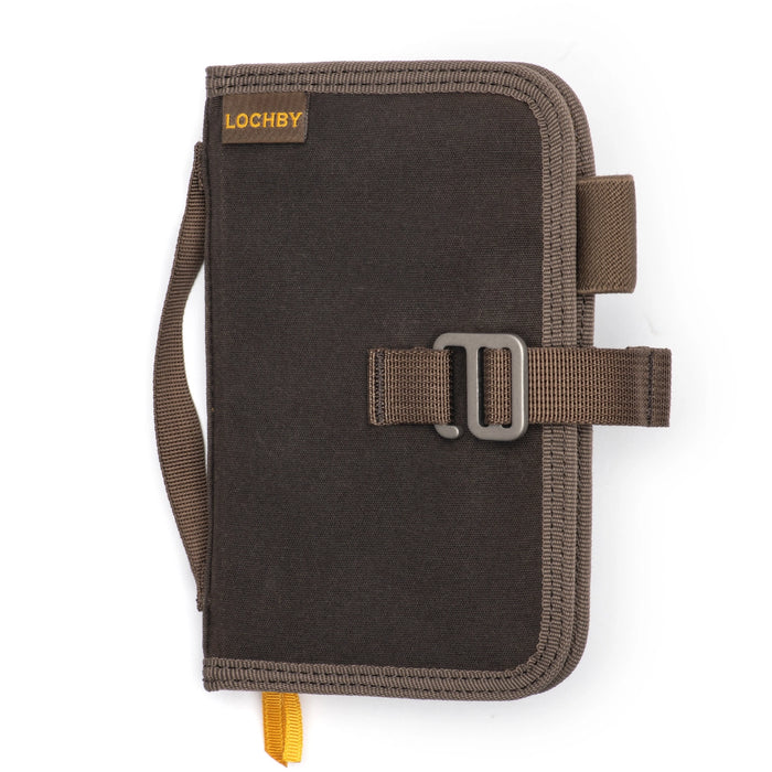 Lochby Mini Field Journal closed, brown waxed canvas, sturdy handle, buckle strap, and vibrant yellow LOCHBY logo label.
