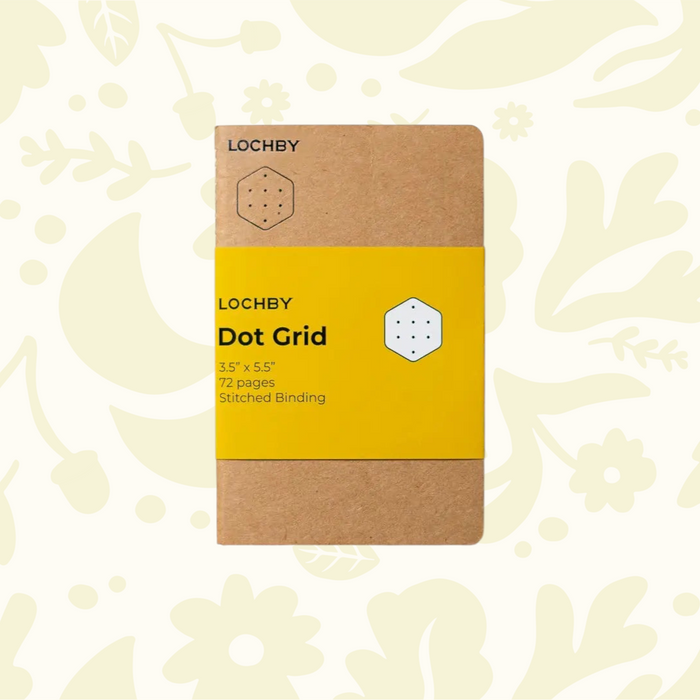 Forager Provisions LTD Lochby pocket notebook with brown cover and yellow dot grid belly band on floral background