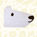 A face of a polar bear with simple black eye and round nose.