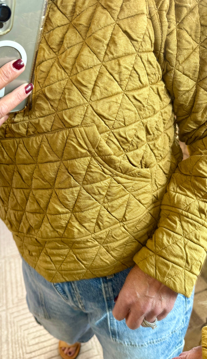 Mustard quilted sweatshirt with diamond-pattern stitching and 1/4 zip collar detail