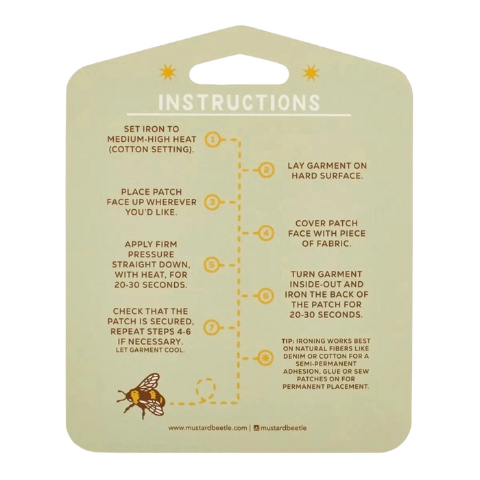 Forager Provisions LTD iron-on patch application instructions on a light green card with a small bee illustration.