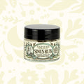 Napiers Sinus Rub Cream 63.5g, herbal congestion relief with black lid, fast-acting natural remedy for outdoor recovery.