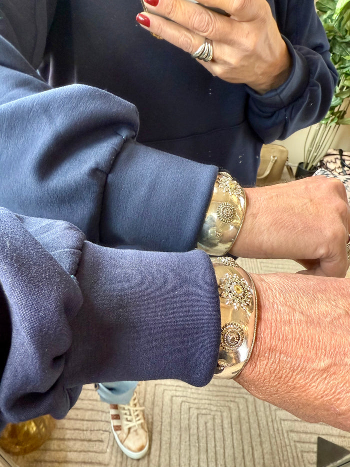 Navy hoodie sweatshirt sleeve and kangaroo pocket close-up