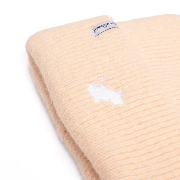 Folded peach Moomin Classics Winter Beanie by Nordicbuddies with sewn white edge label, cozy winter hat, stylish gift.