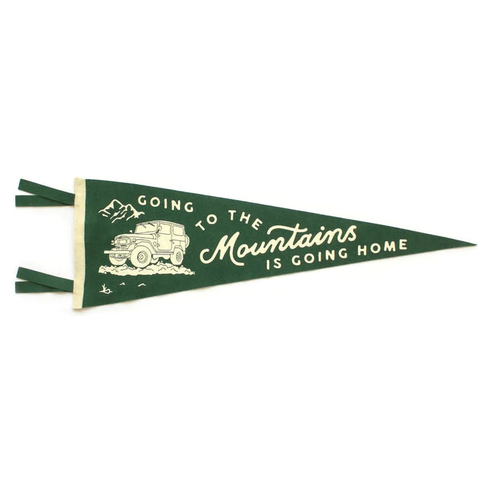 The Oxford Pennant Going To The Mountains features a green outdoor background with a white illustration of an SUV and the John Muir quote, "Going to the Mountains is Going Home.