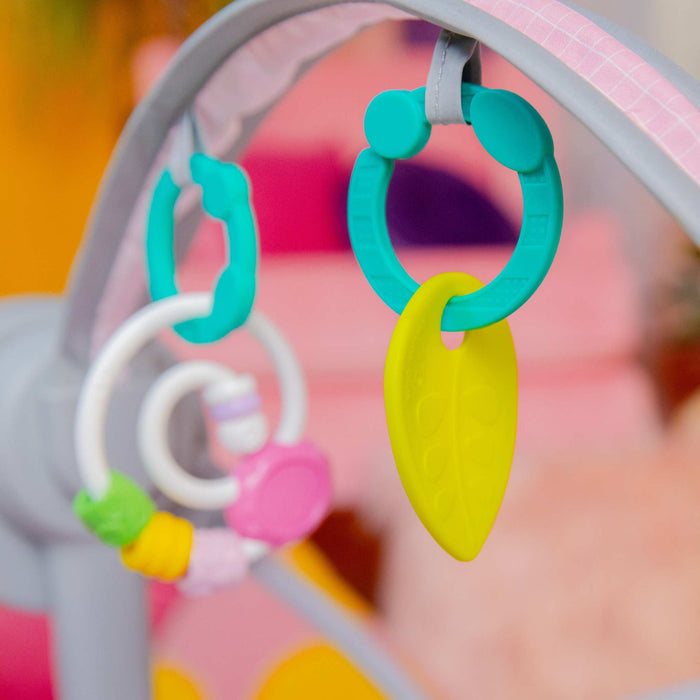 Bright Starts Pink Paradise Portable Swing with interactive toys and adjustable recline for babies