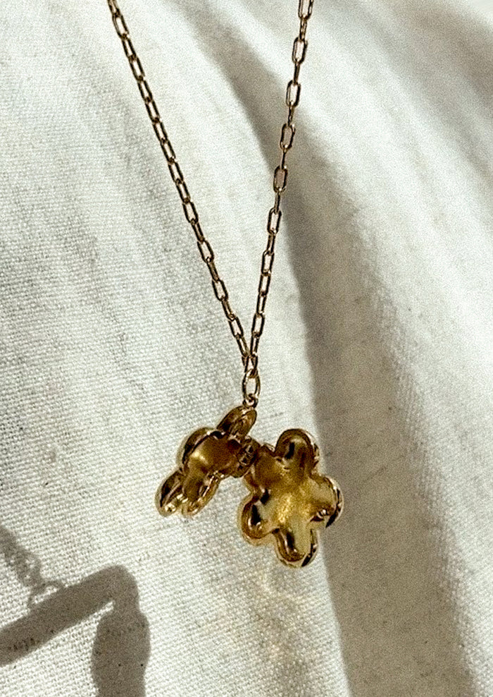 A flower shaped locket necklace that opens.