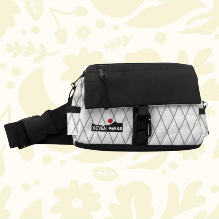 Forager Provisions LTD Seven Peaks black and white water-resistant fanny pack with adjustable strap and front pocket.
