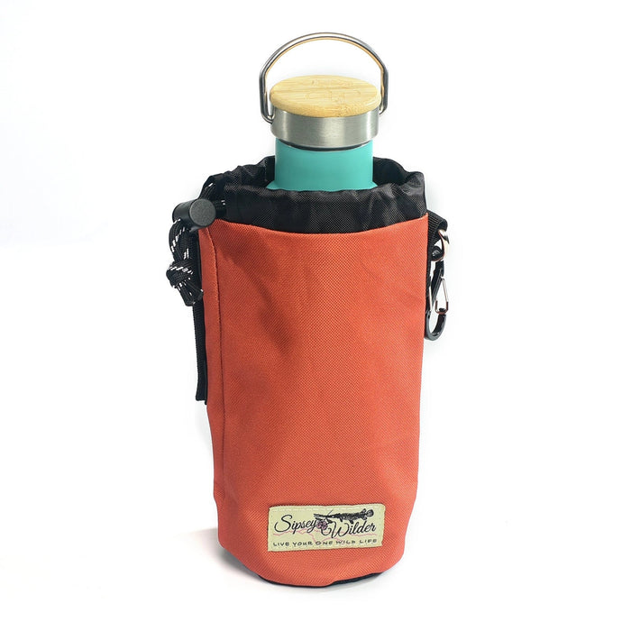Forager Provisions LTD Sipsey Wilder campfire orange water bottle holder with adjustable strap and mesh base.
