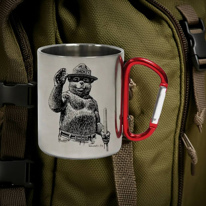 Smokey Bear Carabiner Mug by Tiny Print Shop—waving Smokey design, clips to backpacks, perfect for outdoor adventures.