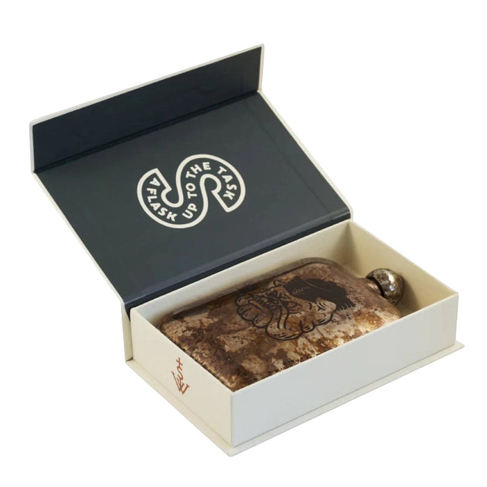 Sneerwell Bulldog whiskey hip flask with design flaw in open white box, branded text shown inside the box lid.