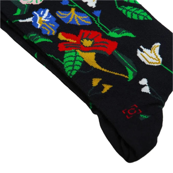 Black socks with vibrant floral designs, inspired by Severin Roesens art. Stylish wearable art from Sock Affairs collection.
