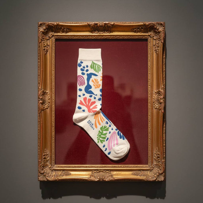 Forager Provisions LTD Matisse-inspired cotton socks featuring vibrant abstract cut-out patterns in a gold frame.