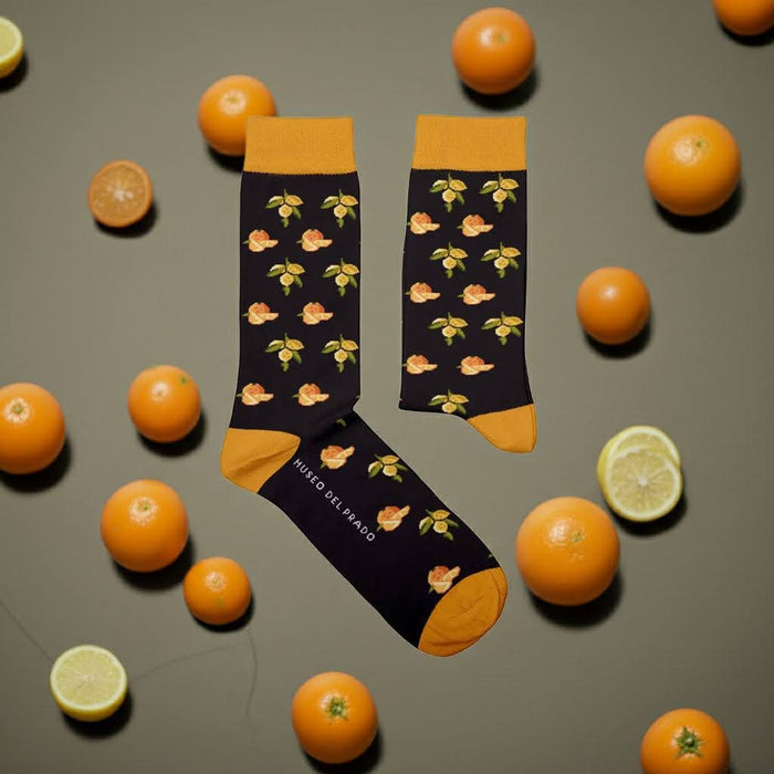 Forager Provisions LTD cotton socks featuring orange and lemon fruit motifs on a black background with yellow accents.