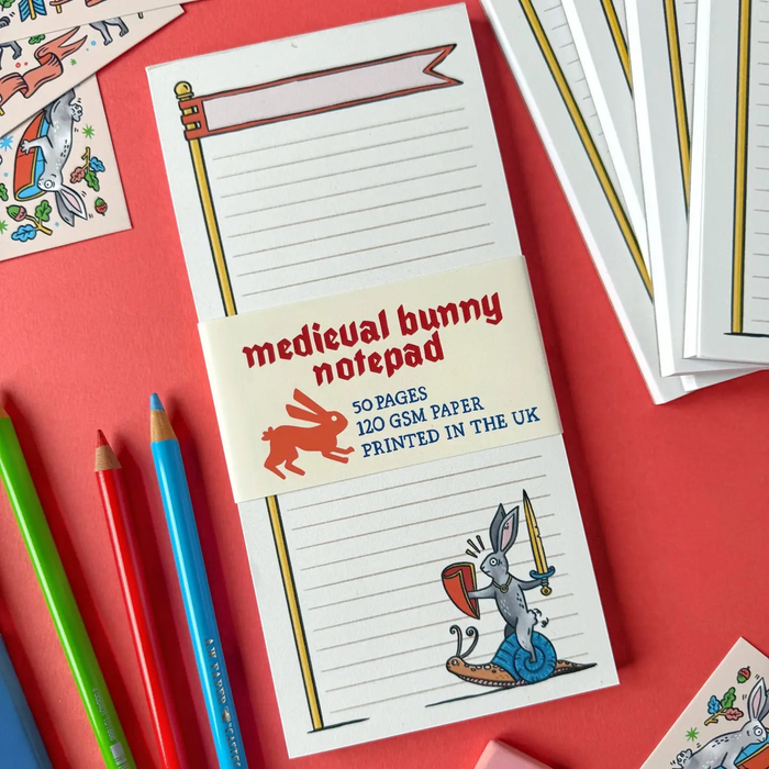 Forager Provisions LTD notepad featuring a medieval illustration of a rabbit knight riding a snail on a lined page.
