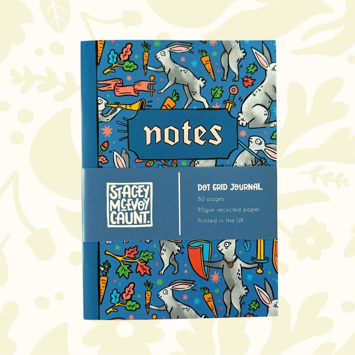 Forager Provisions LTD Stacey McEvoy Caunt A5 dot grid notebook featuring a blue medieval duelling bunnies pattern.