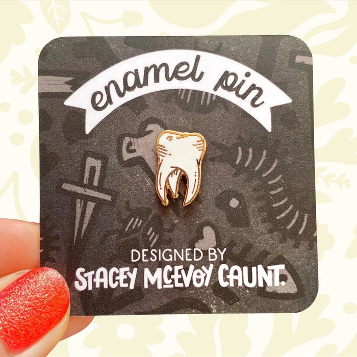 Forager Provisions LTD Medieval Tooth Enamel Pin with gold plating and white enamel on a branded display card