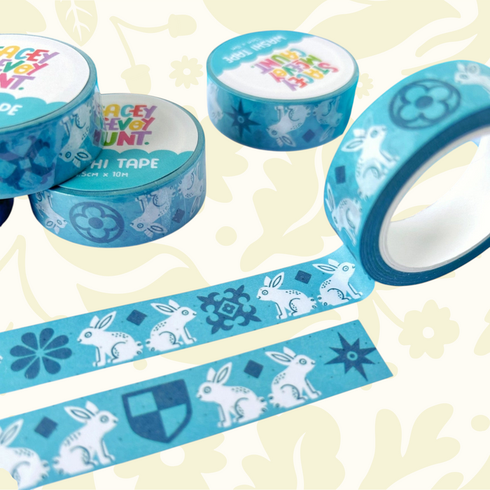 Stacey McEvoy Caunt Medieval Rabbit Tile Washi Tape rolls on dotted paper, with blue pens—planner and journaling supplies.
