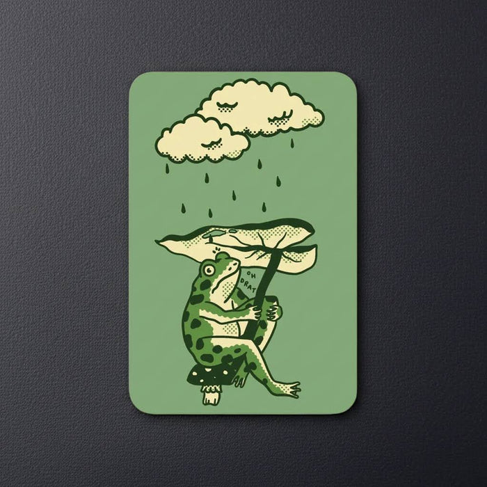 Cute frog sipping a drink under a leaf—Stay Home Club Leaf Umbrella vinyl sticker, perfect for kawaii sticker collections.