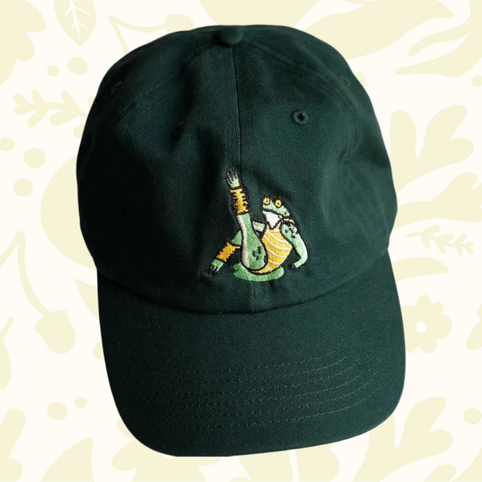 Forager Provisions LTD green cotton dad hat featuring an embroidered frog character on the front panel.