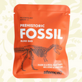Forager Provisions LTD Stemcell Science orange fossil blind bag featuring a dinosaur skeleton illustration.