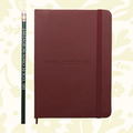 Forager Provisions LTD maroon hardcover journal with Stay Curious debossed cover and matching pencil