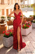 A woman wears a sparkling red sequin gown with a high slit, posing among flowers on a stone patio.
