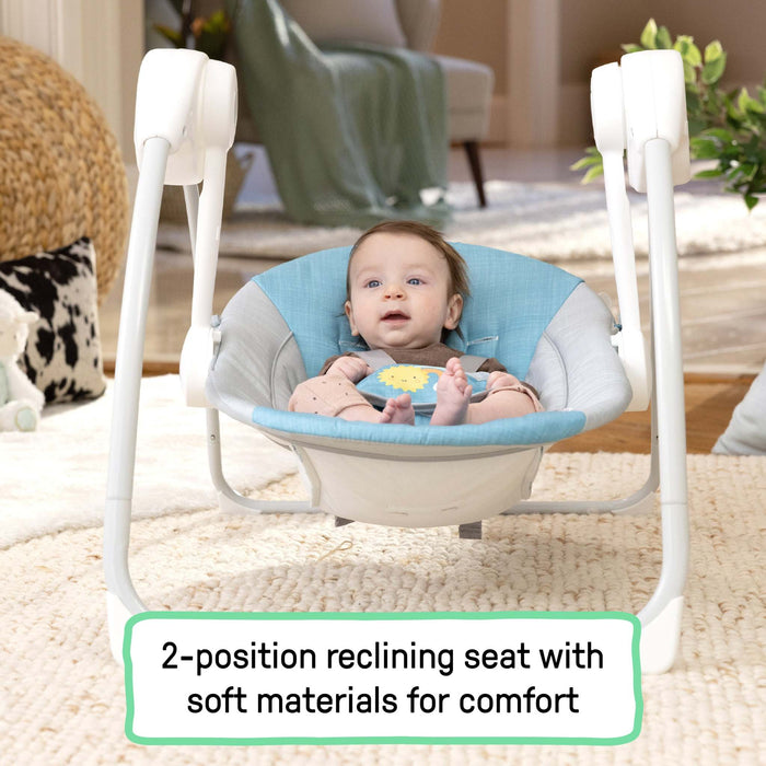 Teal Sun Valley Canopy Portable Swing with canopy, toys, and reclining seat for babies up to 9 months