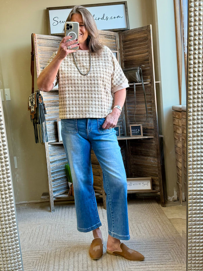 Tan geometric T-shirt with short sleeves and crew neck, patterned knit fabric