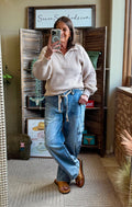 Taupe ribbed knit 1/4-zip sweater with balloon sleeves and quarter-button placket