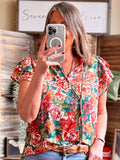 Floral V-neck flutter-sleeve shirt on teal ground with multicolor rose print