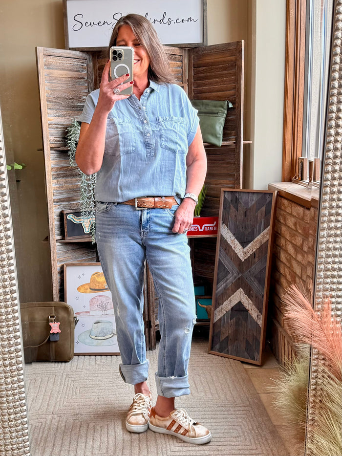 Light blue Tencel pullover shirt with short sleeves, chest pocket, and button-front