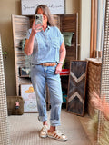 Light blue Tencel pullover shirt with short sleeves, chest pocket, and button-front