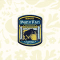 The Adventure Patch Company Pen Y Fan hiking patch souvenir displayed on rustic wood, perfect gift for hikers and collectors.