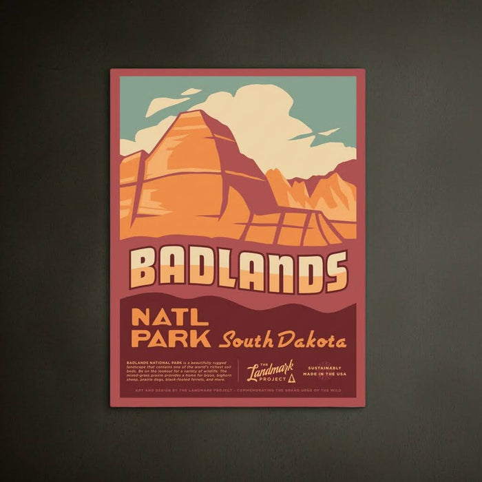 Forager Provisions LTD Badlands National Park poster featuring illustrated buttes and spires in warm sunset tones.