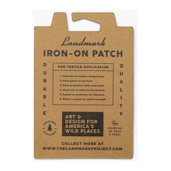 The Landmark Project Everglades National Parks Patch is a rectangular iron-on patch featuring an illustration of Everglades National Park with a vivid orange sunset and serene water scene. It comes packaged on a card using sustainable materials.