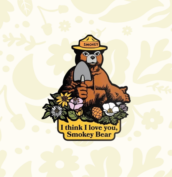 Forager Provisions LTD Smokey Bear vinyl sticker featuring a bear with a shovel and flowers, text I think I love you.