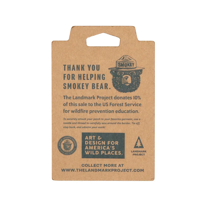 The Landmark Project Smokey Bear Patch - Only You Firewatch features a collectible design showcasing Smokey the Bear's face between large letters spelling "YOU" with the message "ONLY YOU CAN PREVENT WILDFIRES." This officially licensed product from the USDA Forest Service promotes wildfire prevention education.