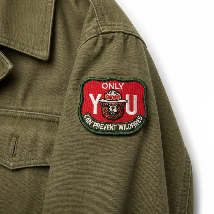 Forager Provisions LTD embroidered Smokey Bear patch featuring the Only You Can Prevent Wildfires message on a jacket