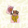 Peach Fuzz Flower Boy Lighter (TBC 2026): vintage-style lighter with yellow cartoon flower and pink smiling face.