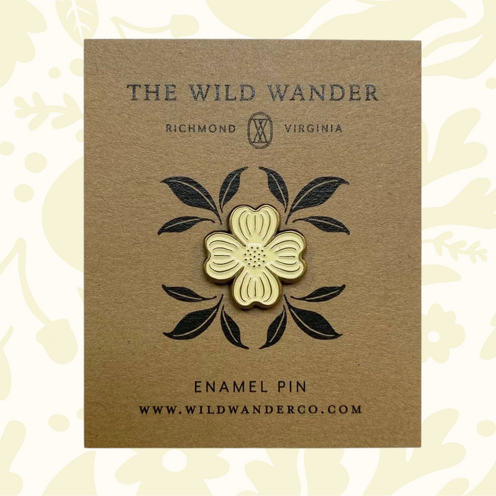 Forager Provisions LTD ivory dogwood flower enamel pin with antique gold accents on a kraft backing card.