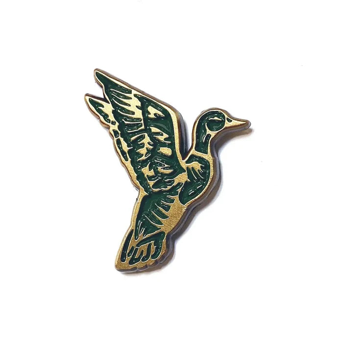 The Wild Wander Mallard Duck Flying Enamel Pin for birdwatchers, unique bird gift, displayed on a clean white background.