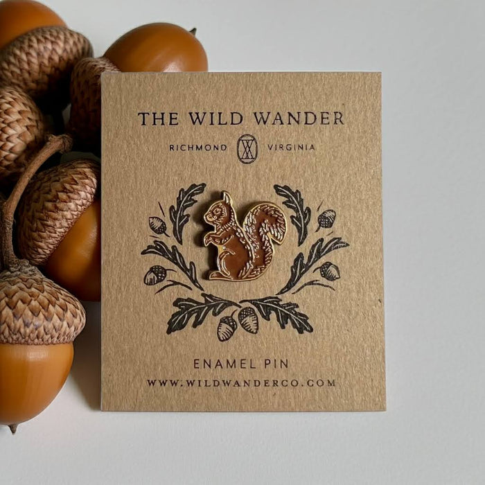 Forager Provisions LTD red squirrel enamel pin with antique gold accents on an illustrated kraft backing card