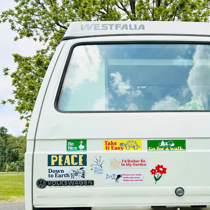 White Volkswagen Westfalia van with Three Potato Four I Stop For Flowers magnet, perfect for camper van road trip lovers.