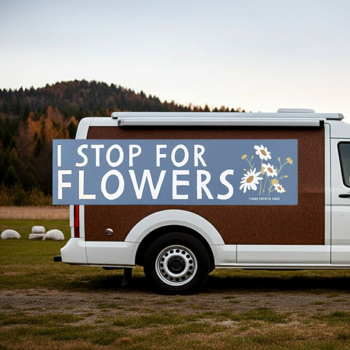 Forager Provisions LTD Three Potato Four camper van magnet with blue background, white text, and daisy illustrations.