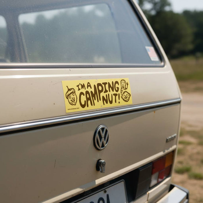 Forager Provisions LTD yellow I'm A Camping Nut vinyl bumper sticker applied to the back of a beige vintage van