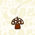 Universal Ironworks Redcap Mushroom Hanging Decoration suspended by string, displayed on white wooden background farmhouse decor.