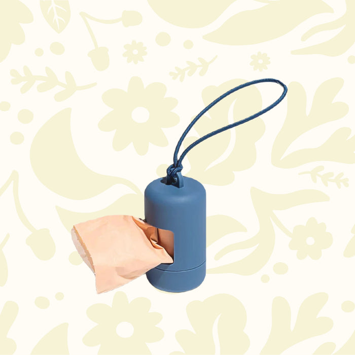 Wild One Navy dog bag dispenser attaches to leash; fits peach fabric or paper bags. Pet waste bag holder for walks.