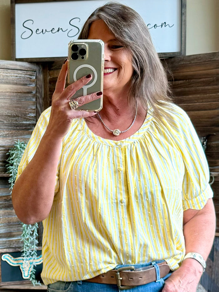 Yellow and white striped short-sleeve shirt with dotted accents and round gathered neckline